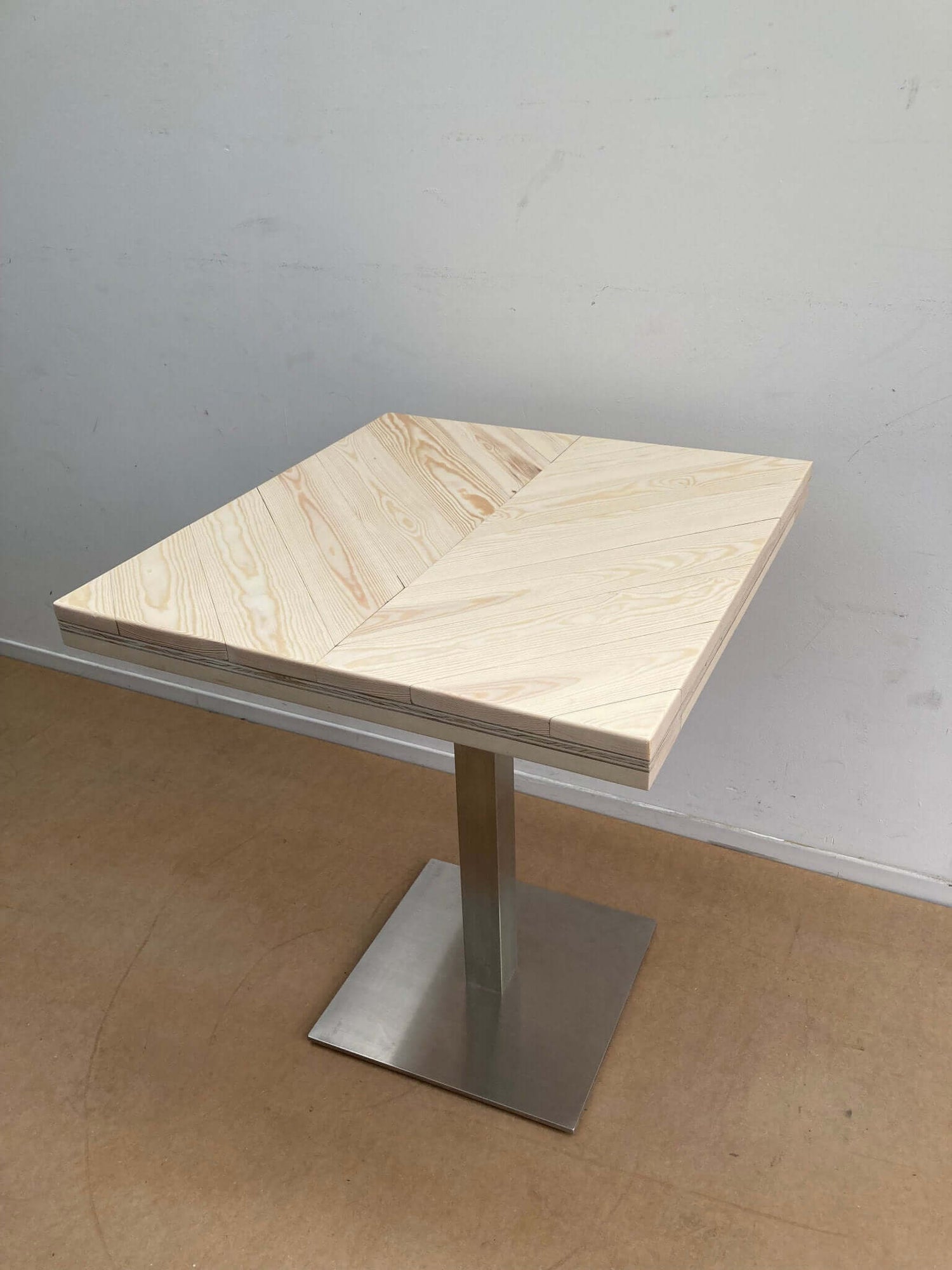 repurposed wood small table with industrial legs.