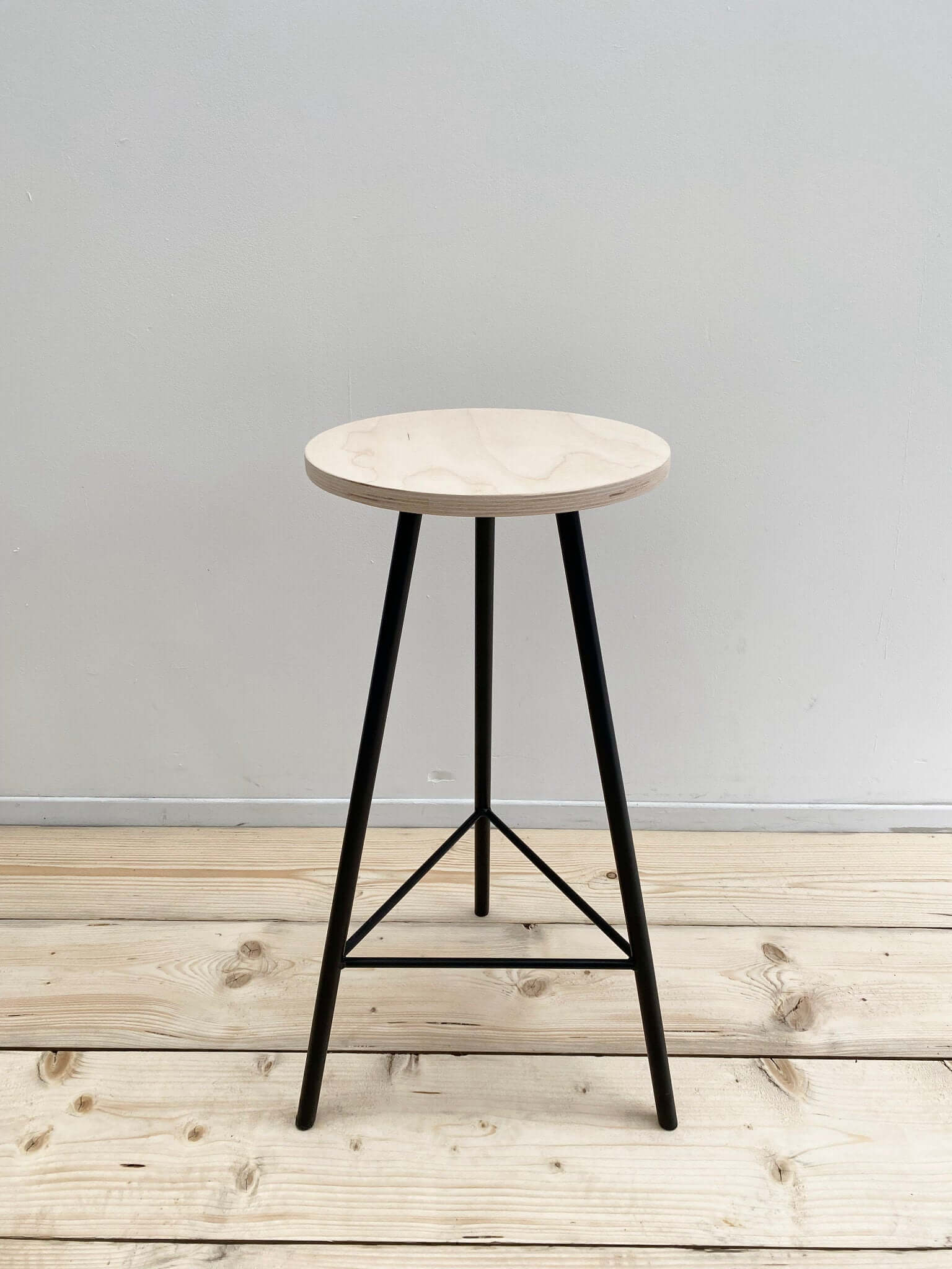 Repurposed wood stool with optional base.