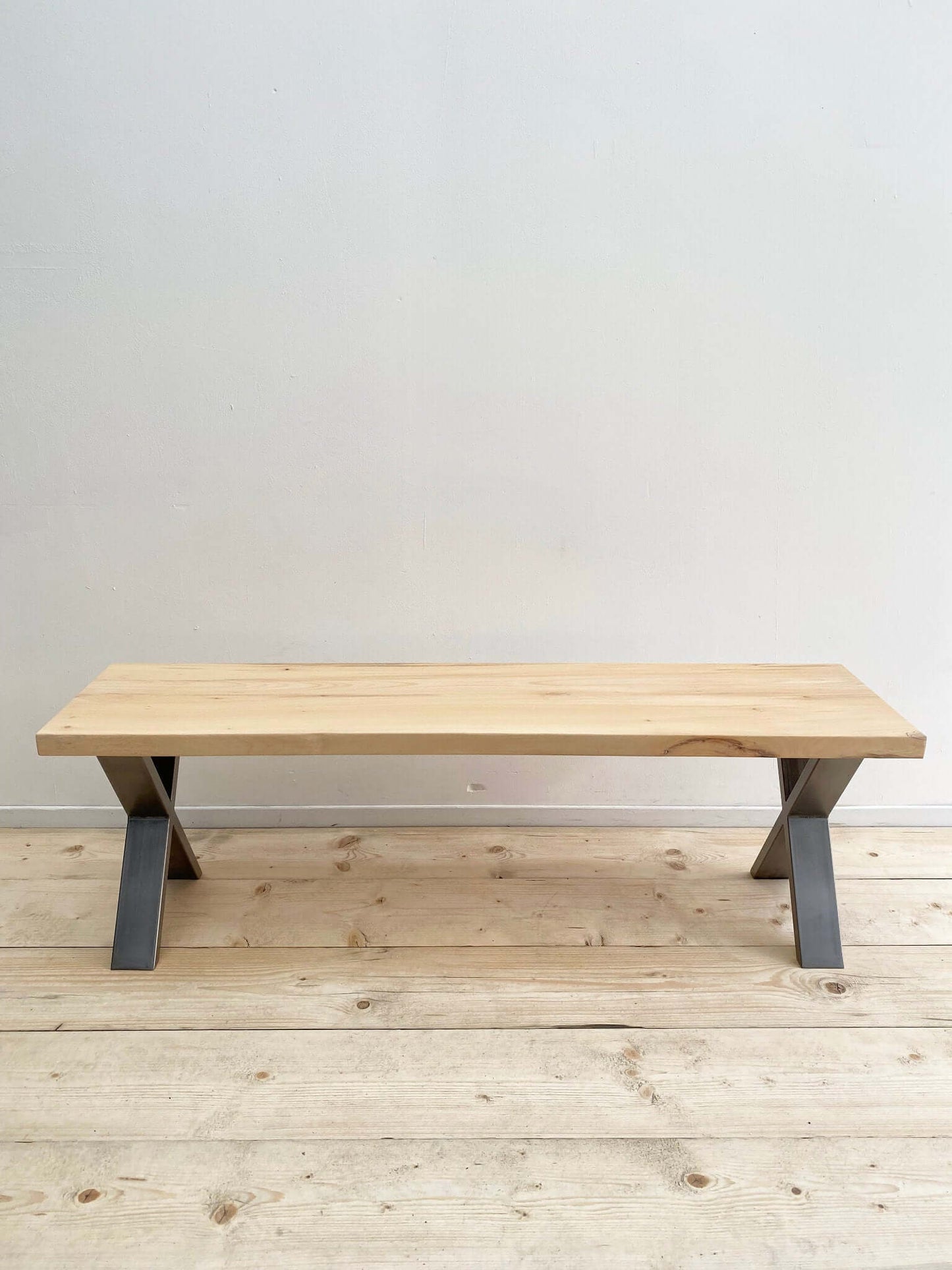 Hardwood bench seat with industrial legs.