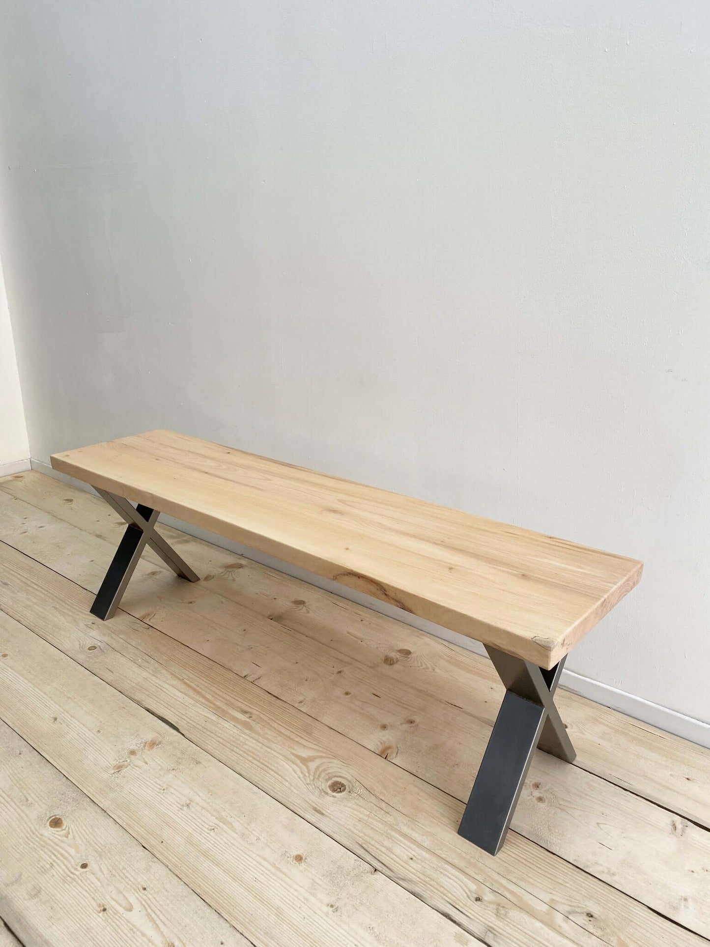 Hardwood bench seat with industrial legs.