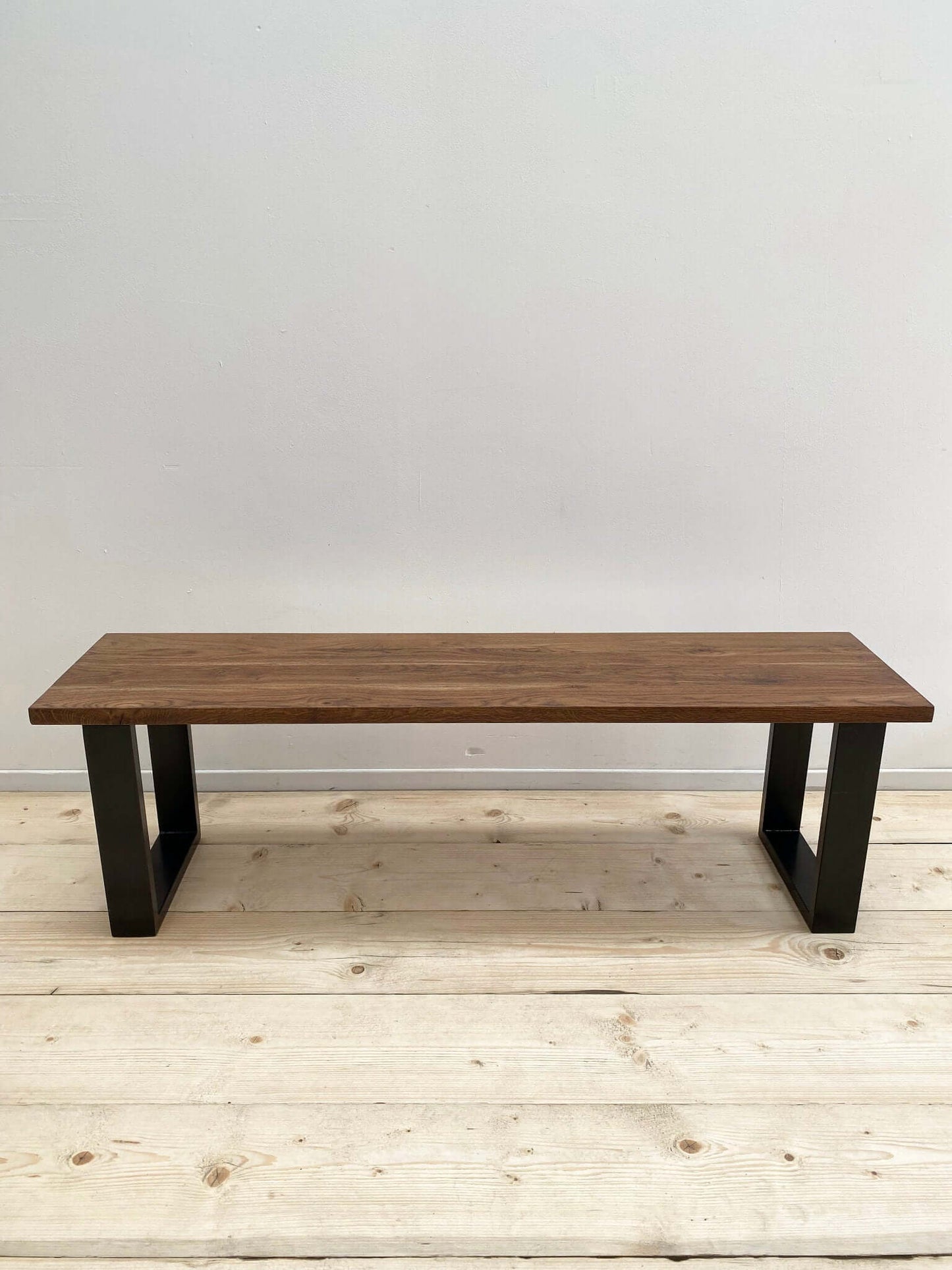 Hardwood bench seat with industrial legs.