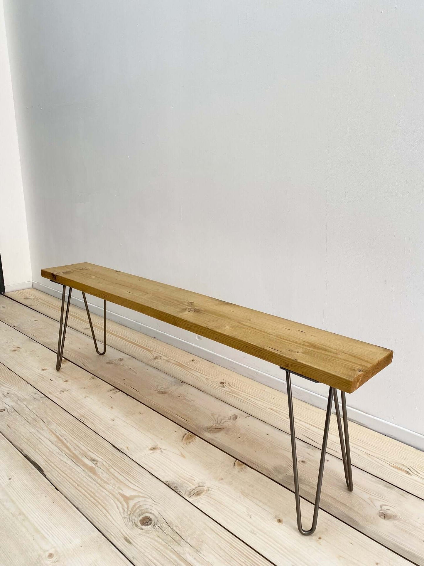 Reclaimed wood bench seat with hairpin legs.