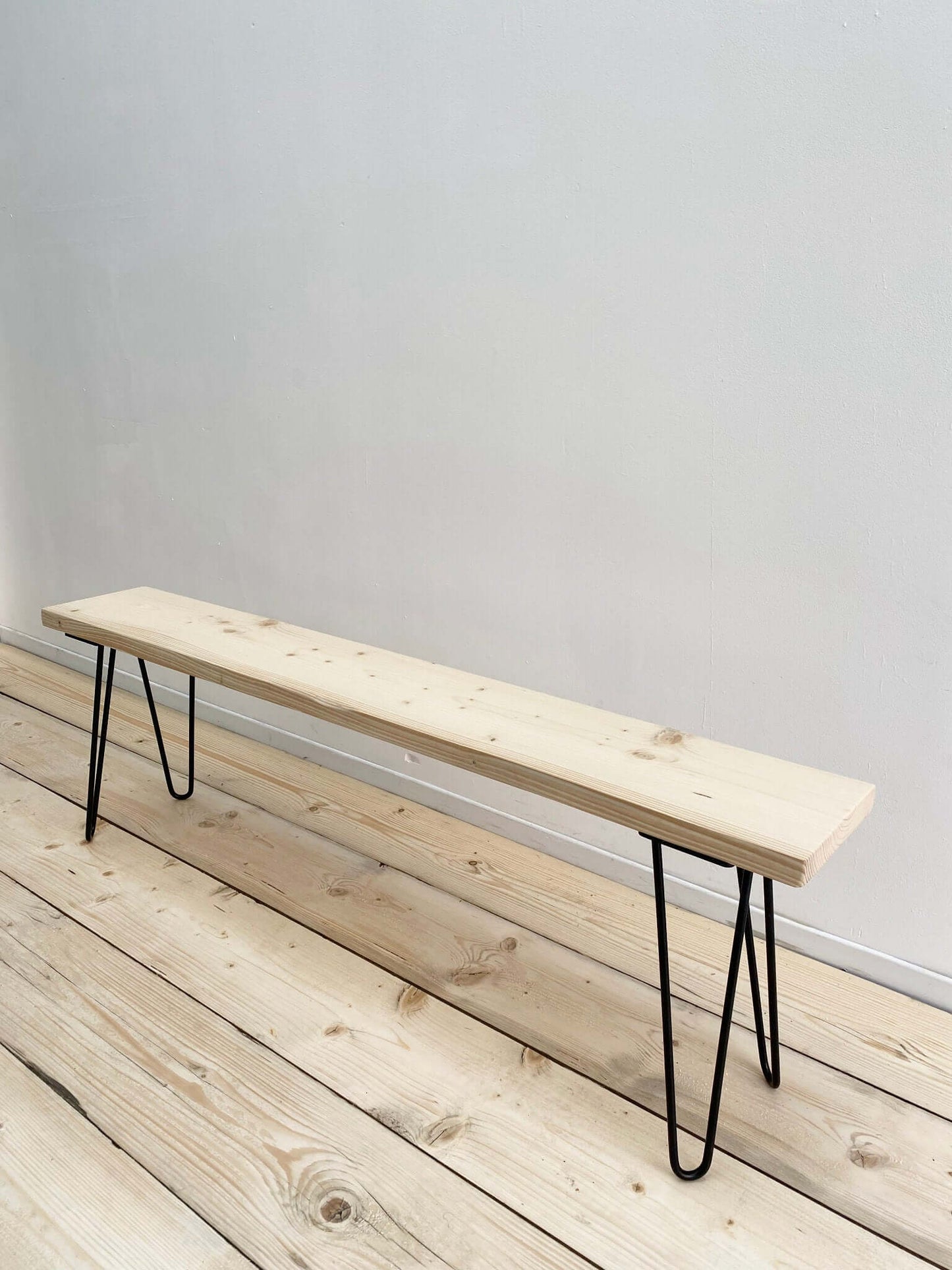 Reclaimed wood bench seat with hairpin legs.