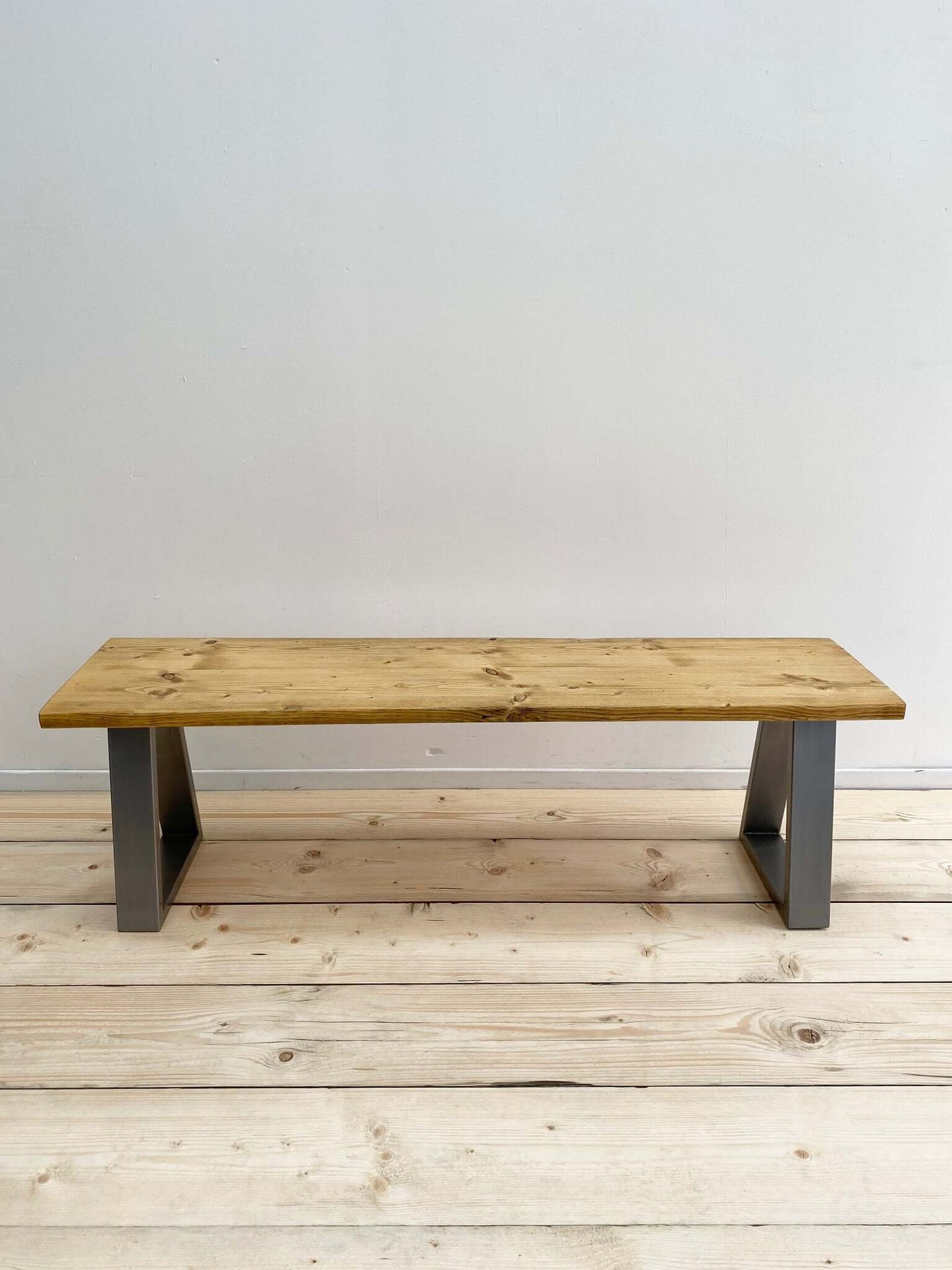 Reclaimed wood bench seat with industrial legs.