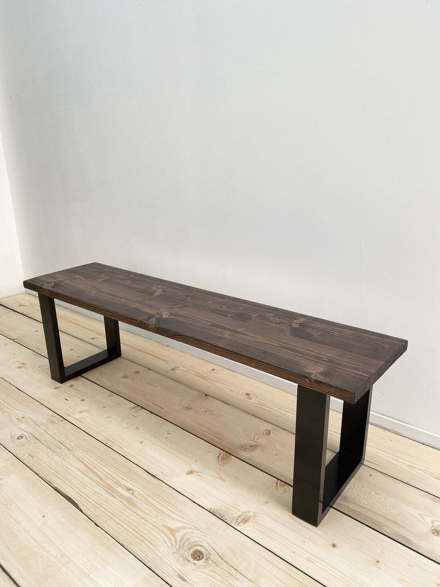 Reclaimed wood bench seat with industrial legs.