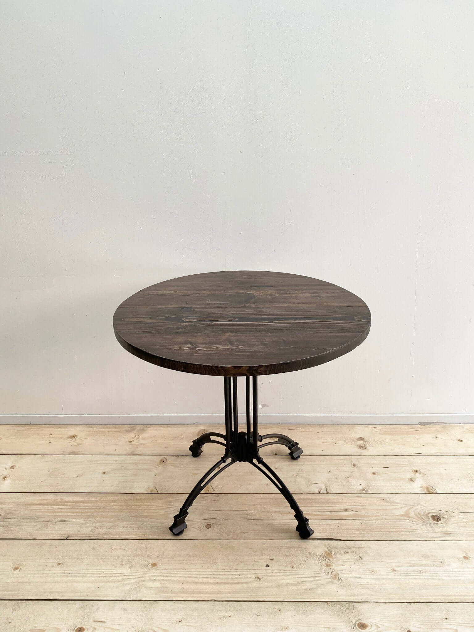 Reclaimed wood circle dining table with pedestal.