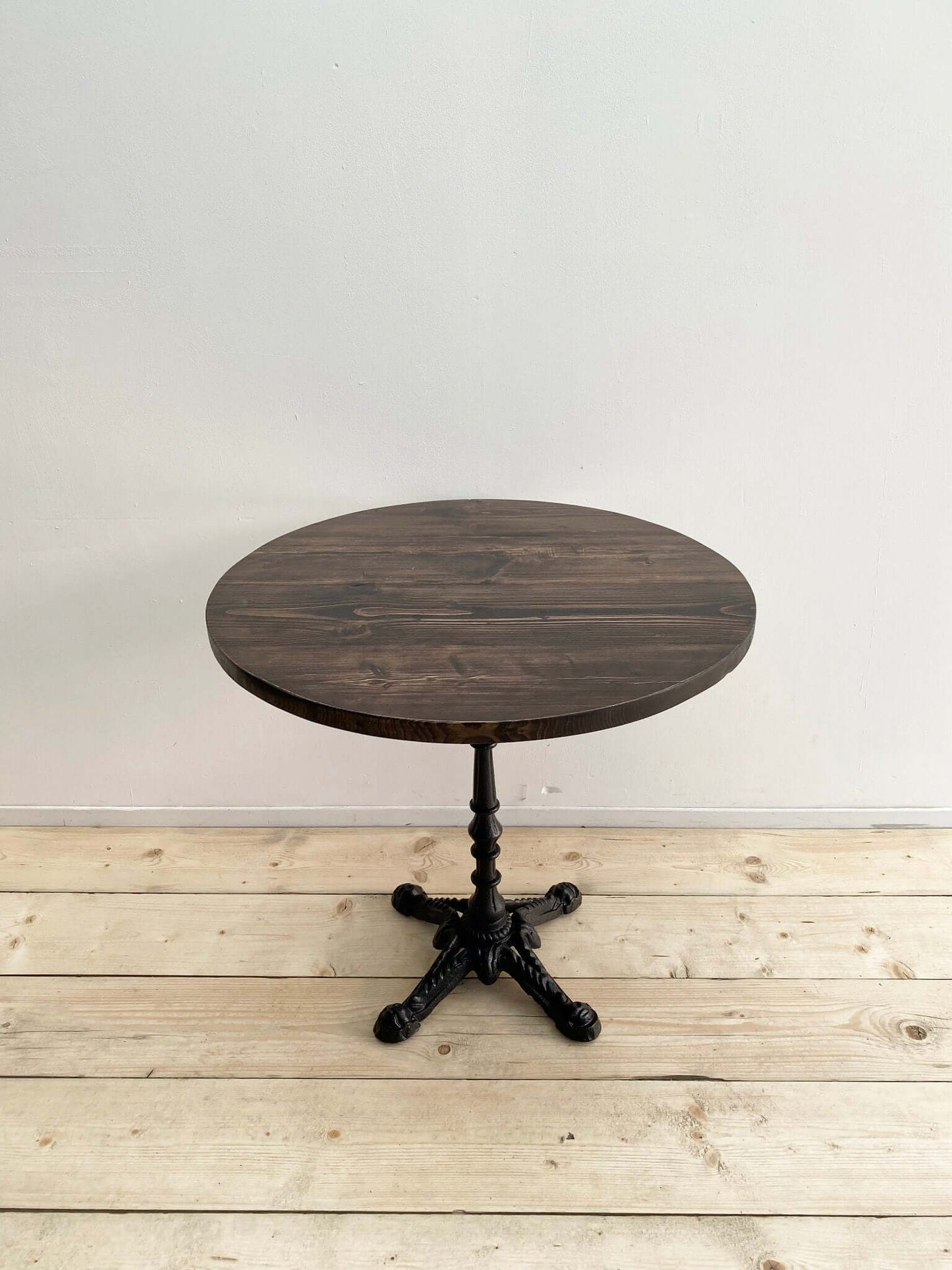 Reclaimed wood circle dining table with pedestal.