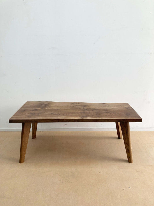 Hardwood coffee table with solid wood legs.