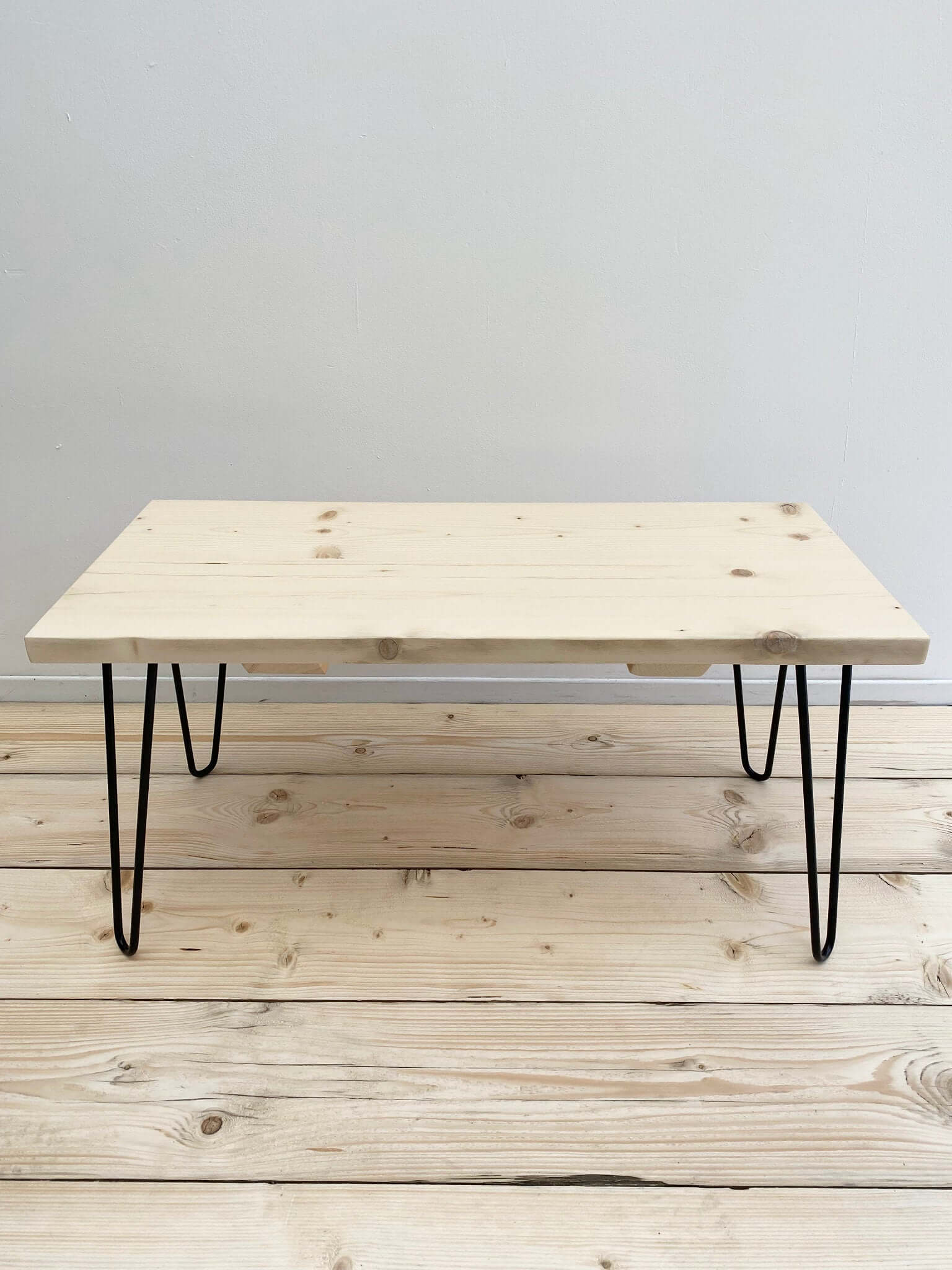 Reclaimed wood coffee table with hairpin legs.
