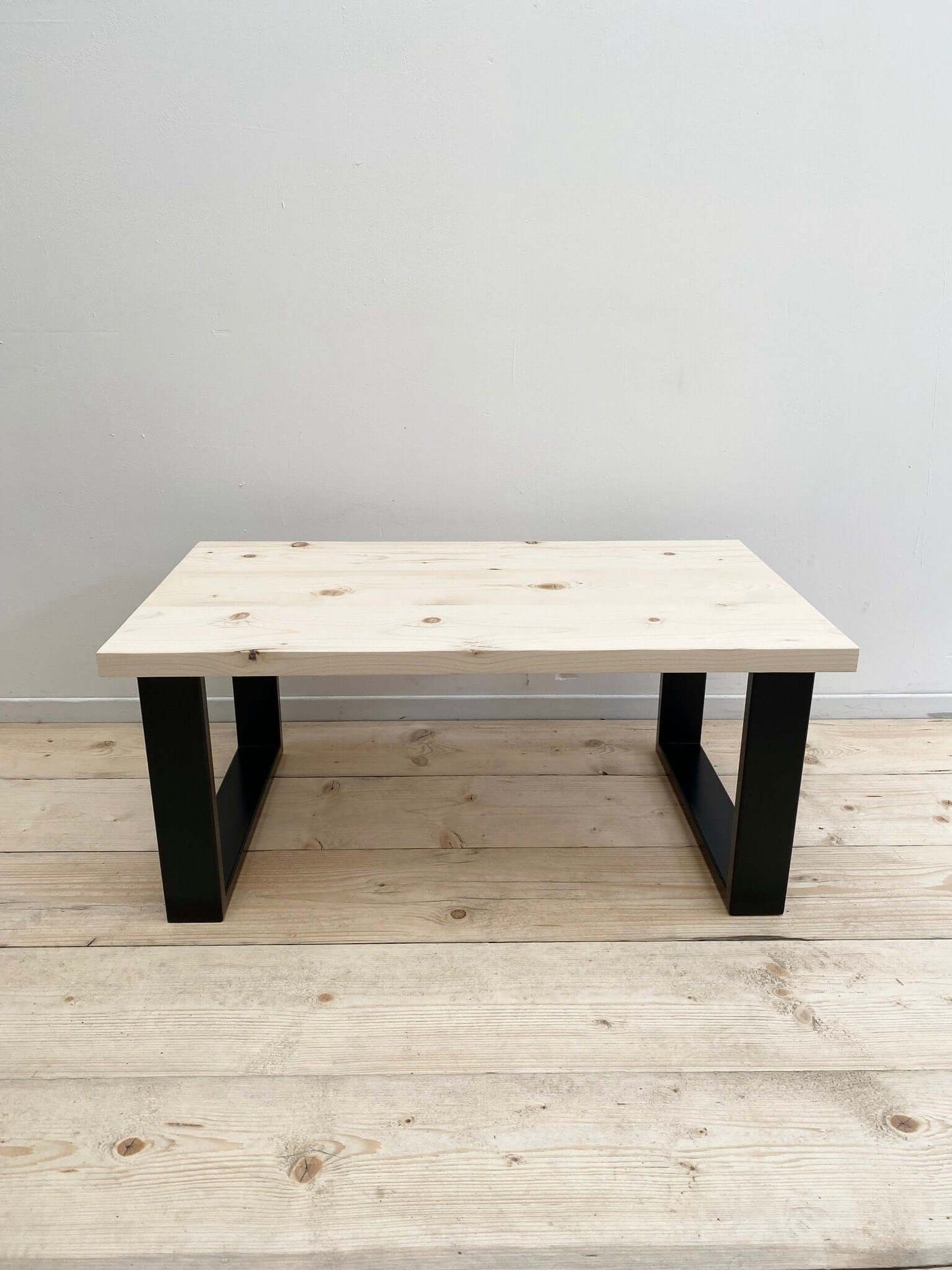 Reclaimed wood coffee table with industrial legs.