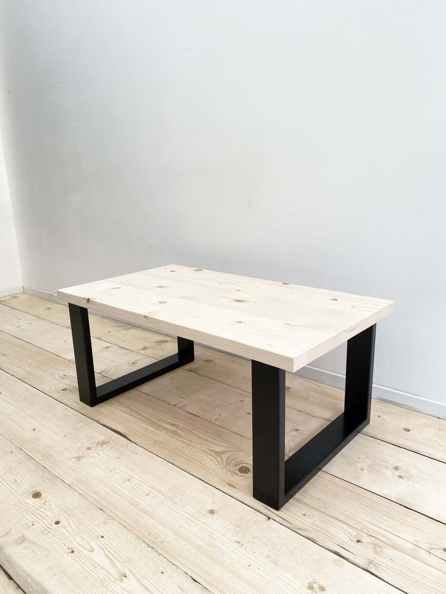 Reclaimed wood coffee table with industrial legs.