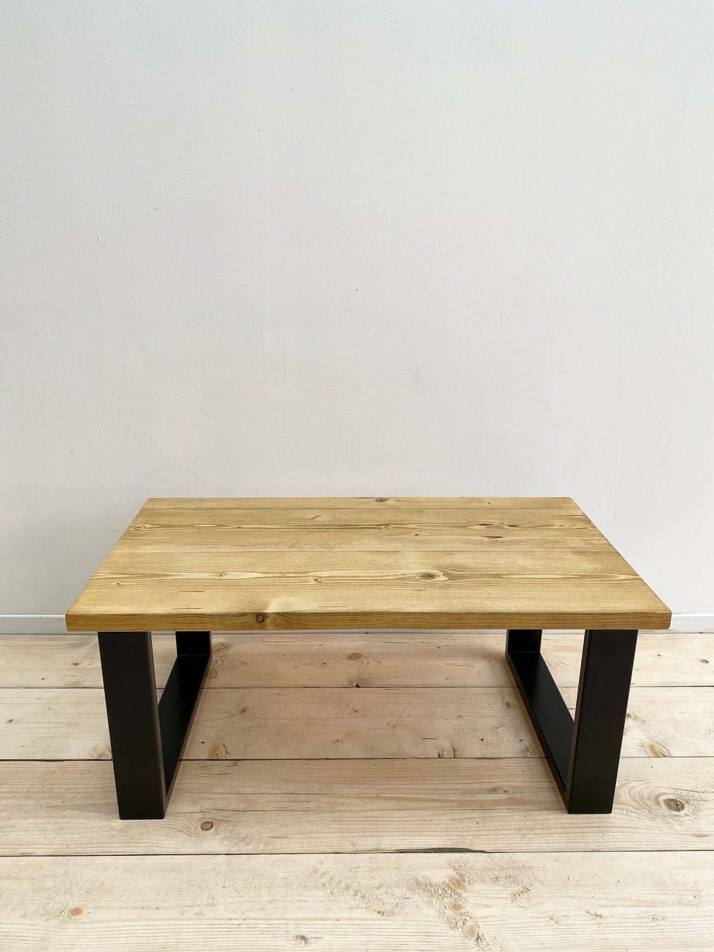 Reclaimed wood coffee table with industrial legs.