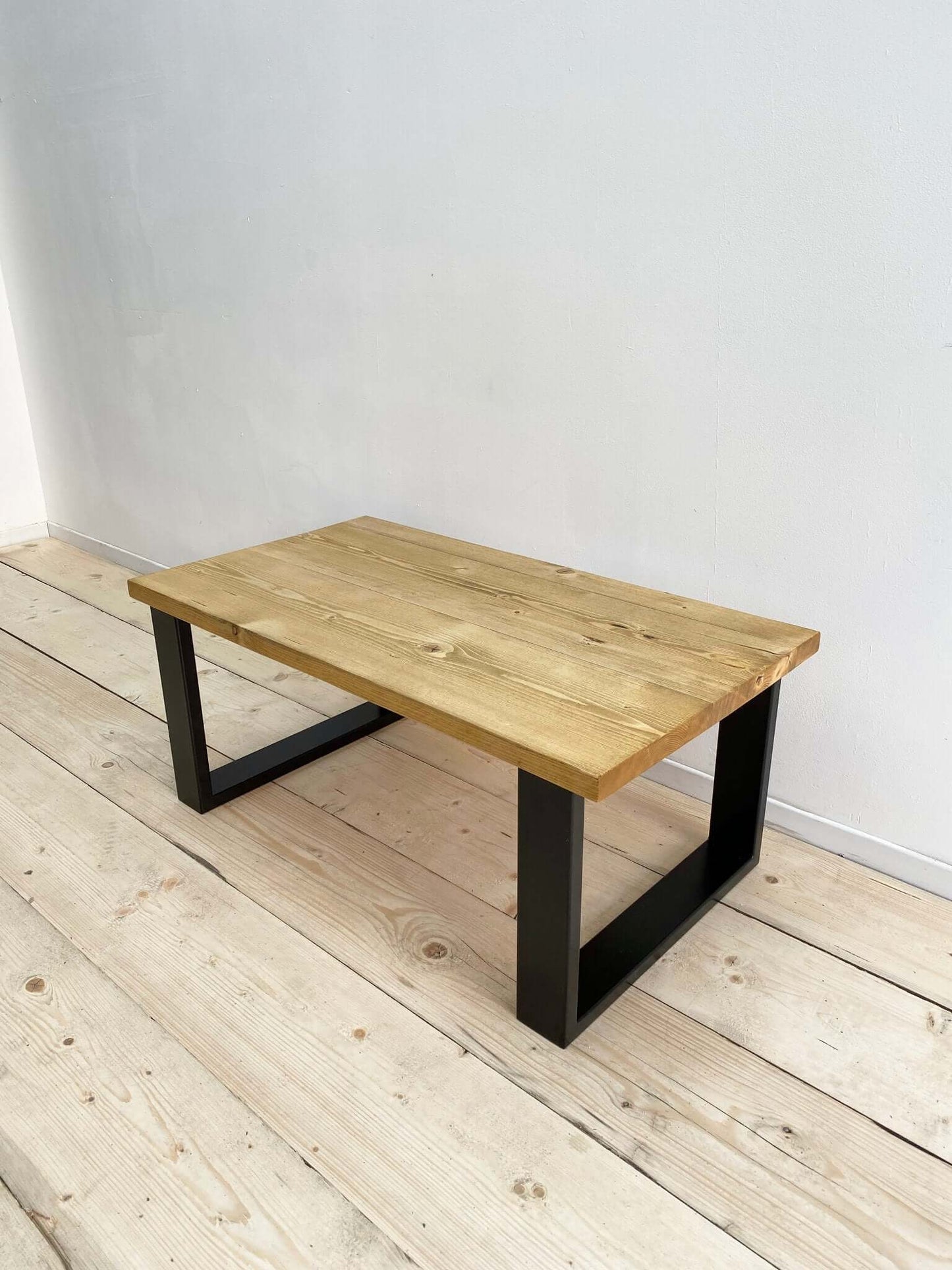 Reclaimed wood coffee table with industrial legs.