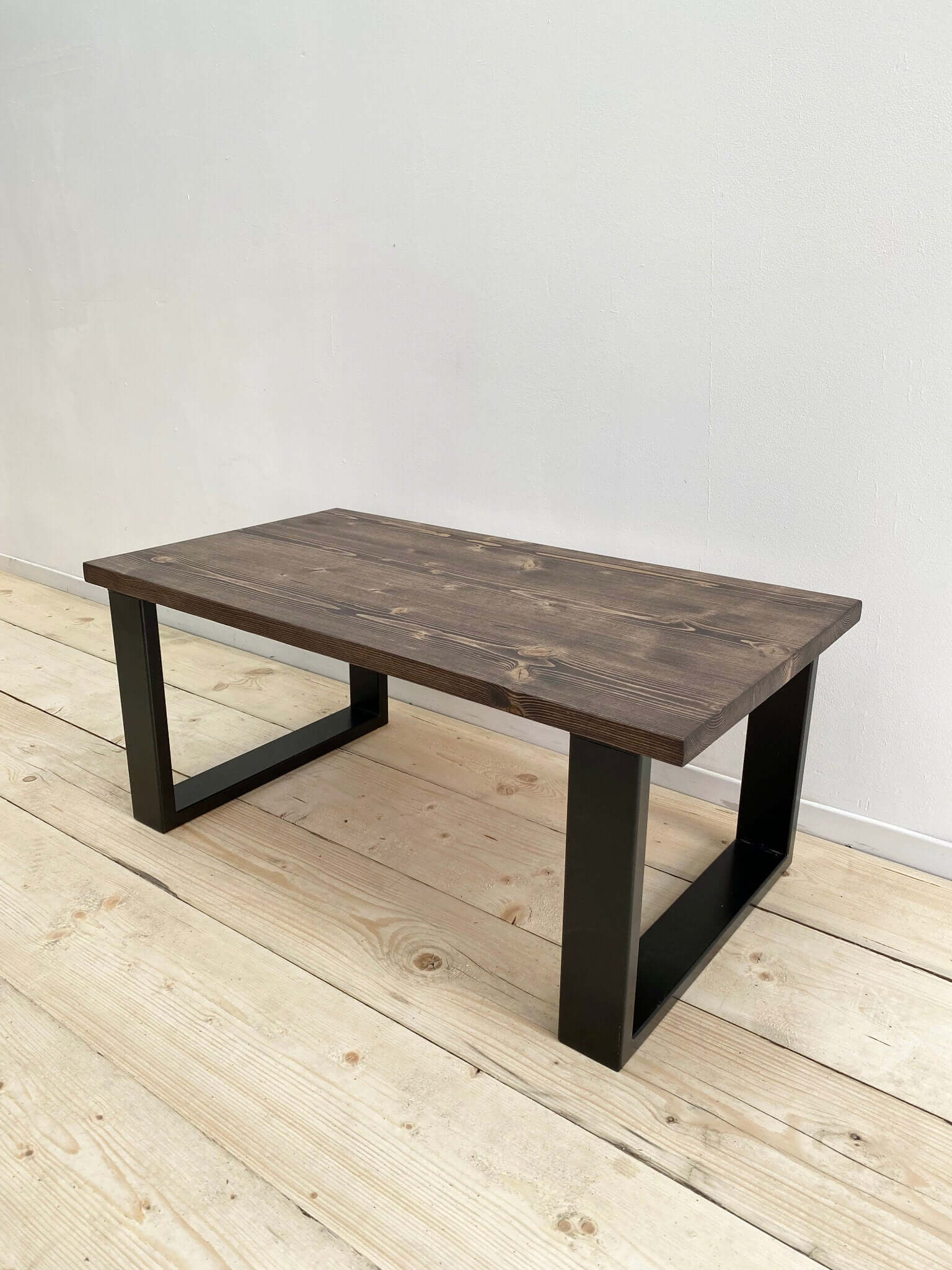 Reclaimed wood coffee table with industrial legs.