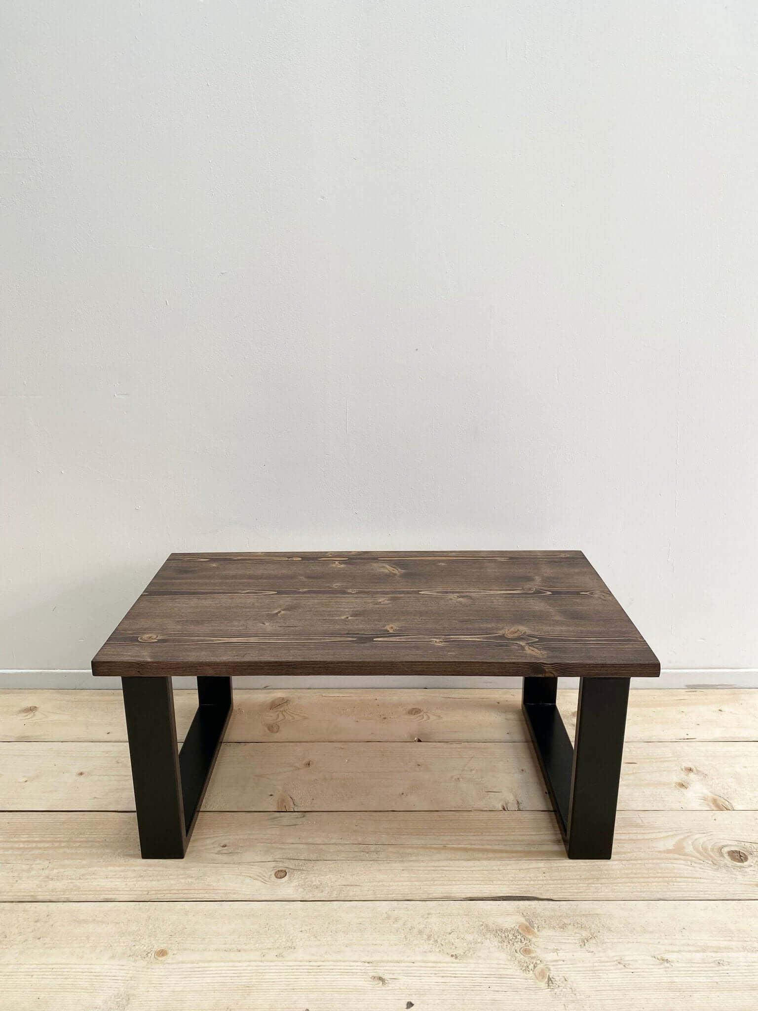Reclaimed wood coffee table with industrial legs.