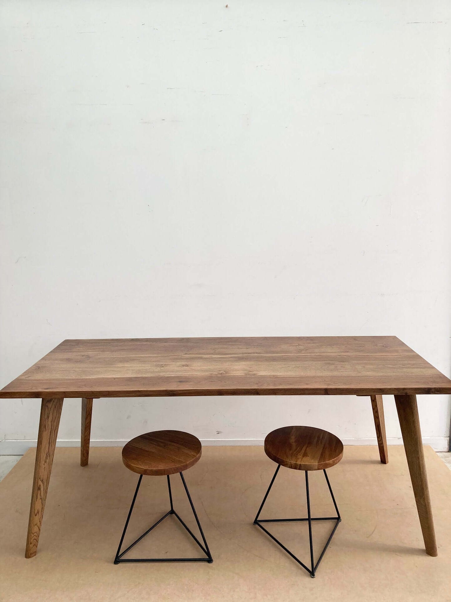 Hardwood large dining table with solid wood legs.