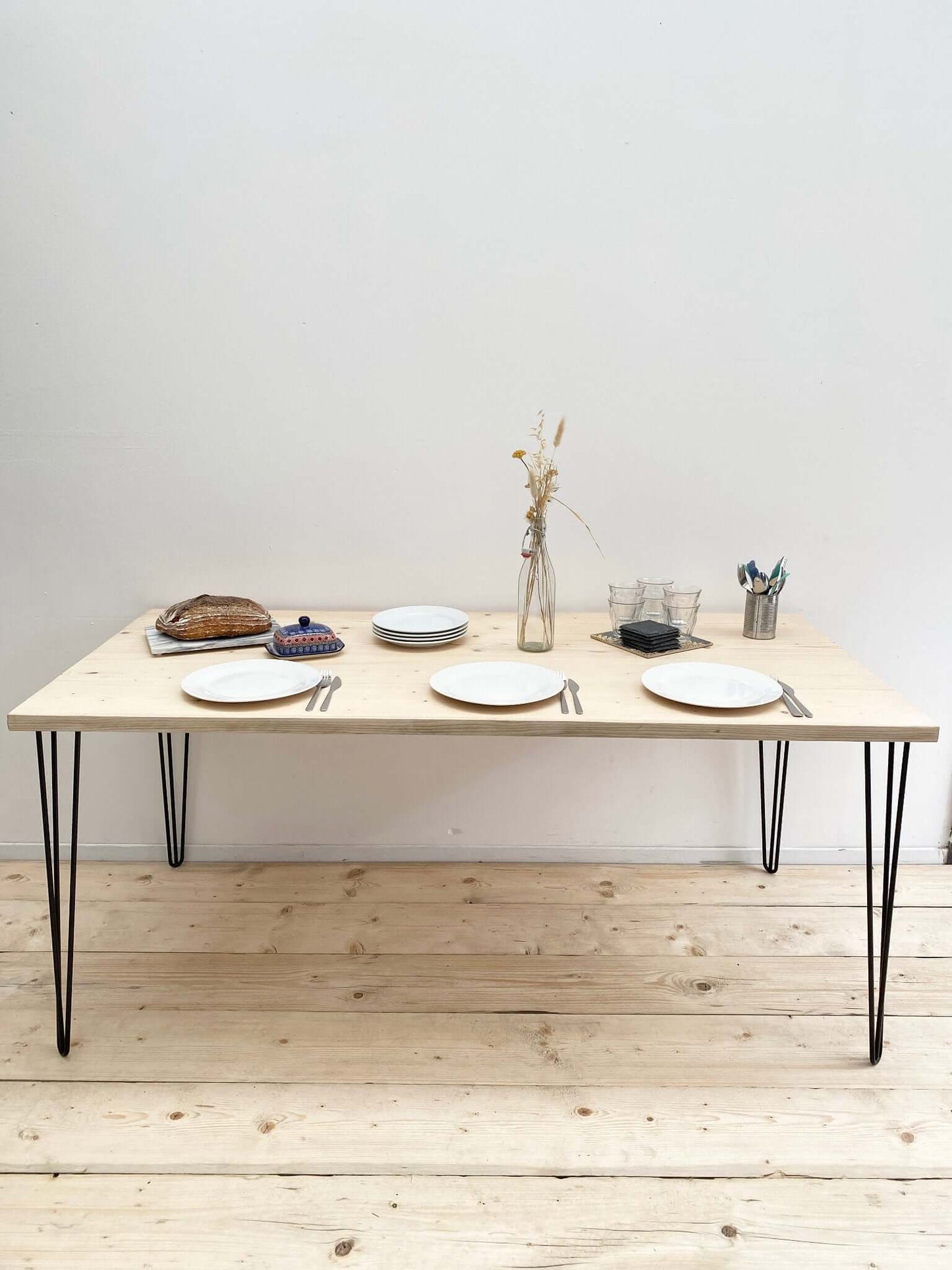 Reclaimed wood large dining table with hairpin legs.