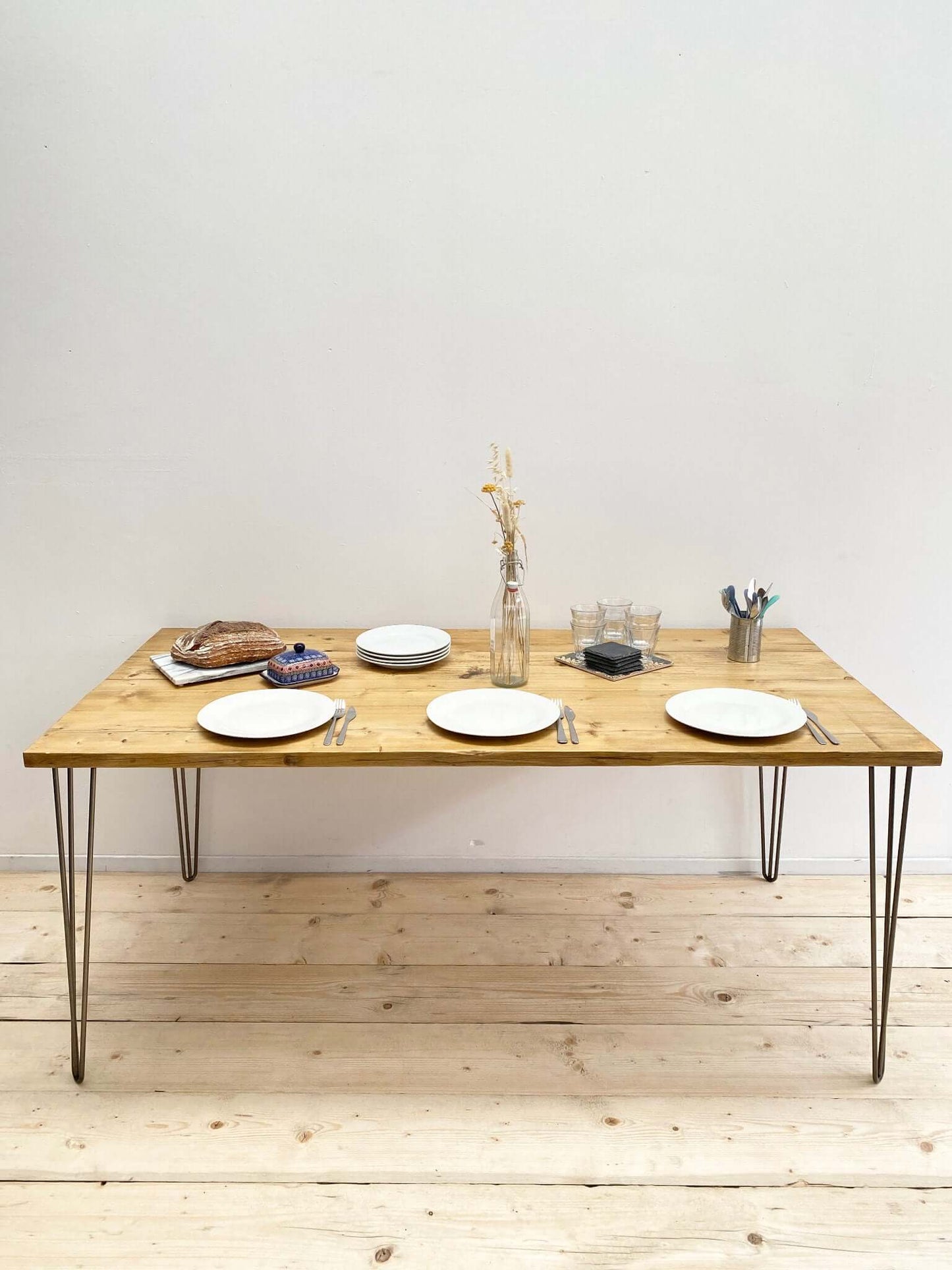Reclaimed wood large dining table with hairpin legs.