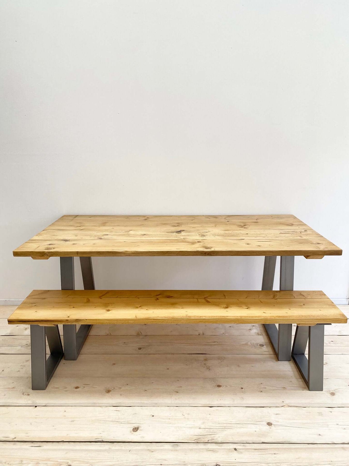 Reclaimed large dining table with industrial legs.