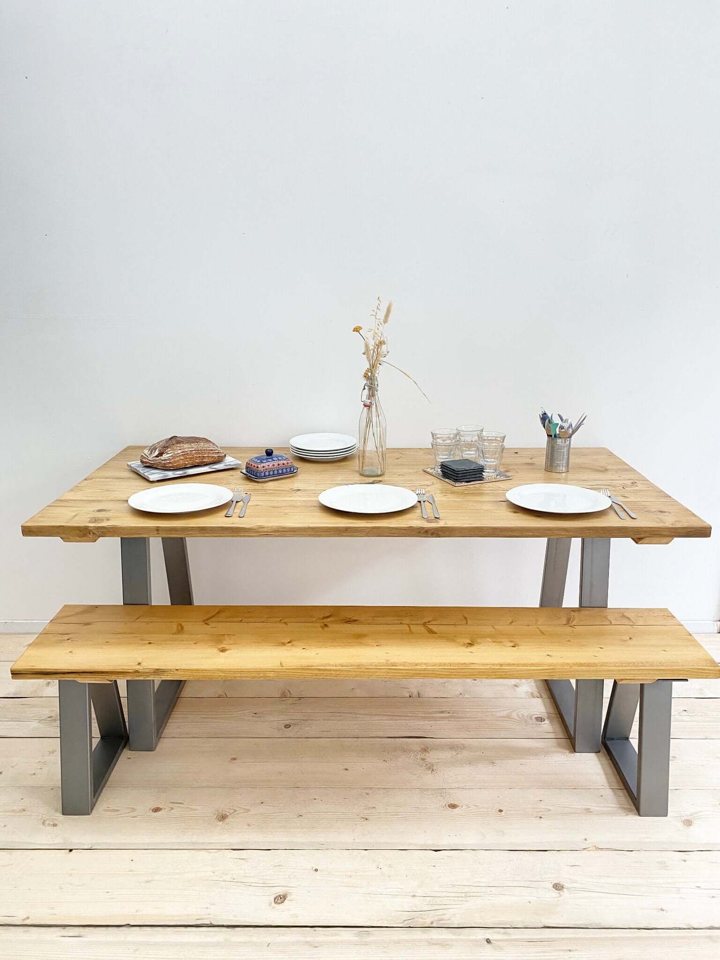 Reclaimed large dining table with industrial legs.