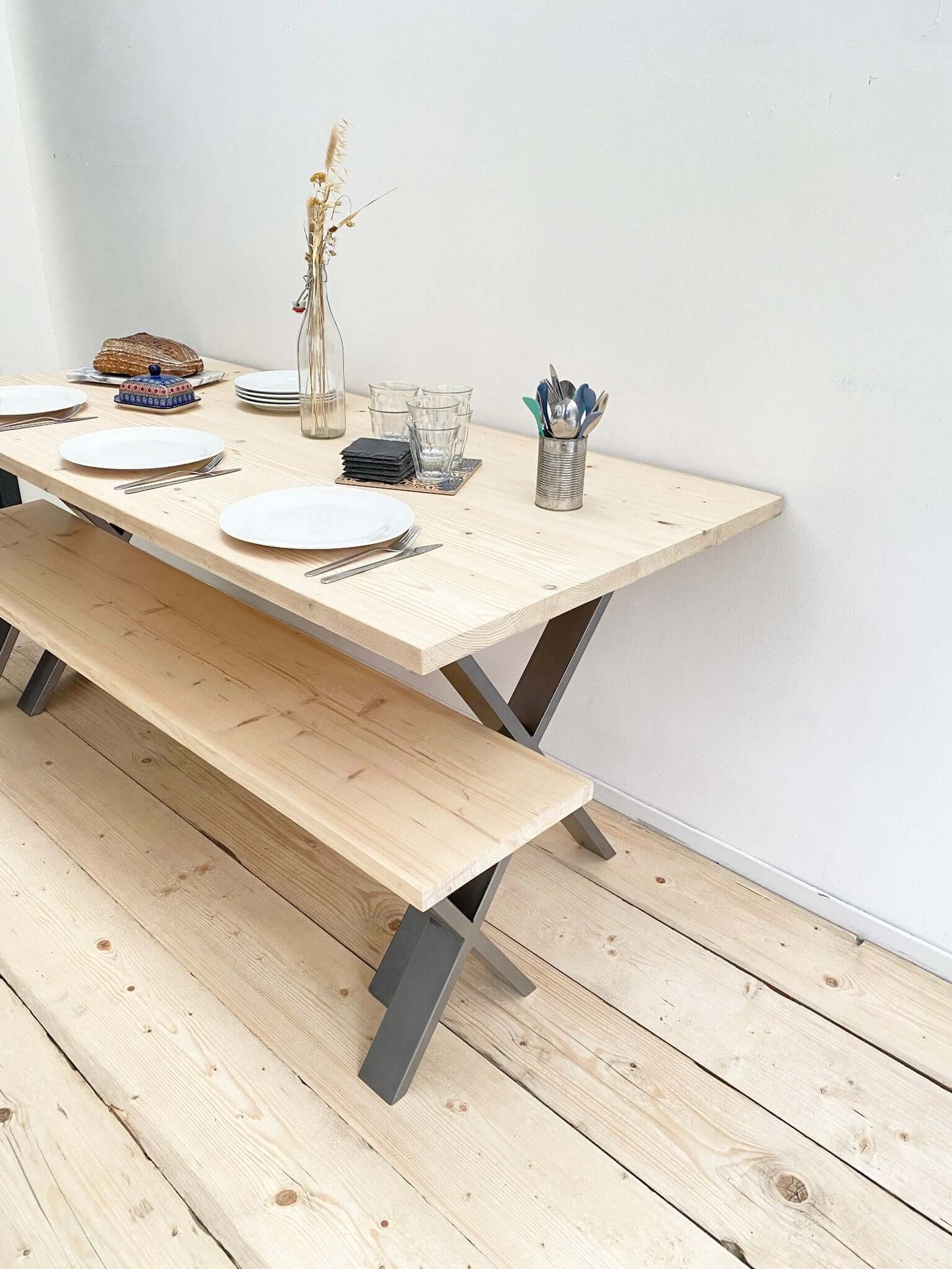 Reclaimed large dining table with industrial legs.