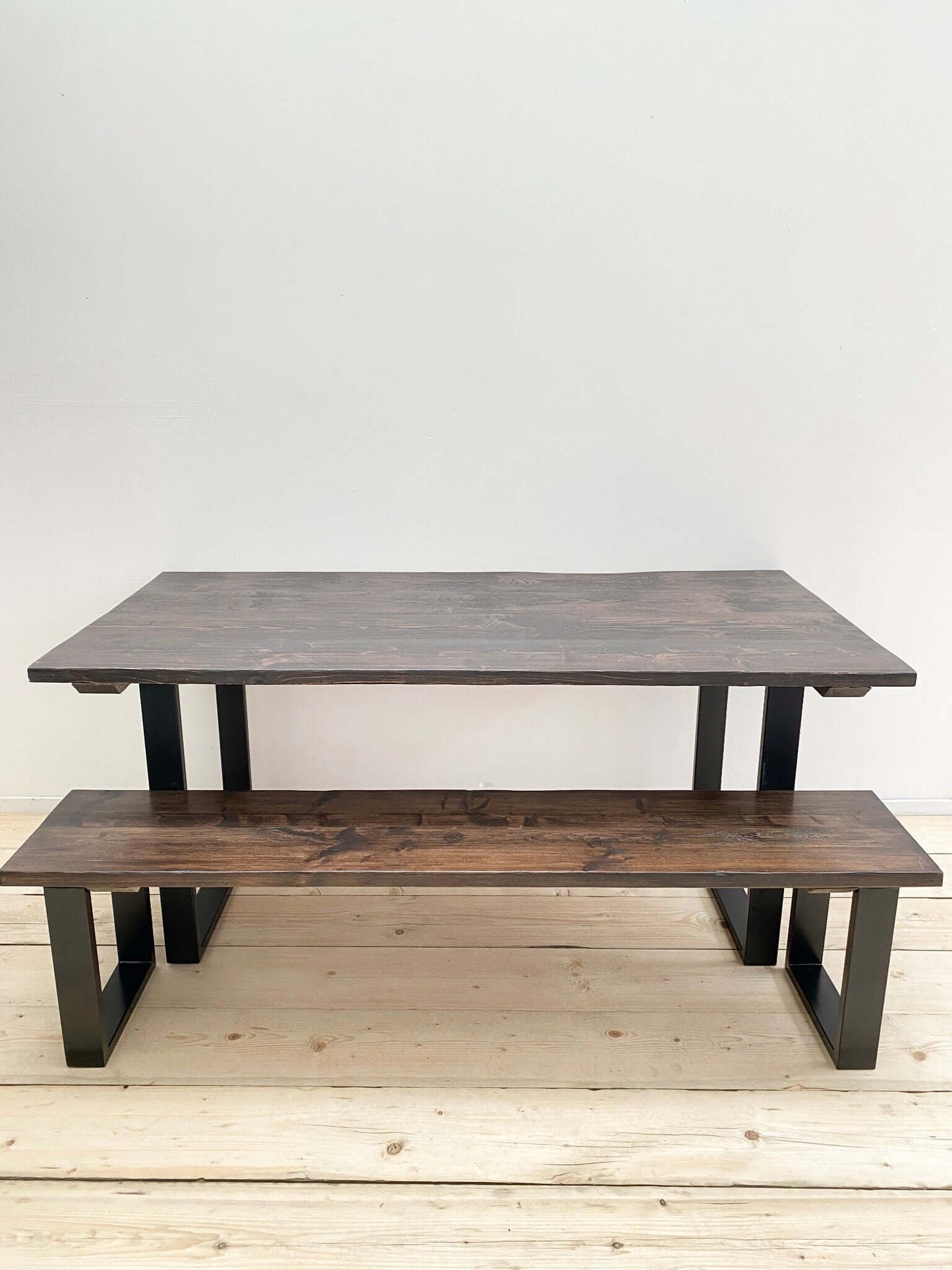 Reclaimed large dining table with industrial legs.