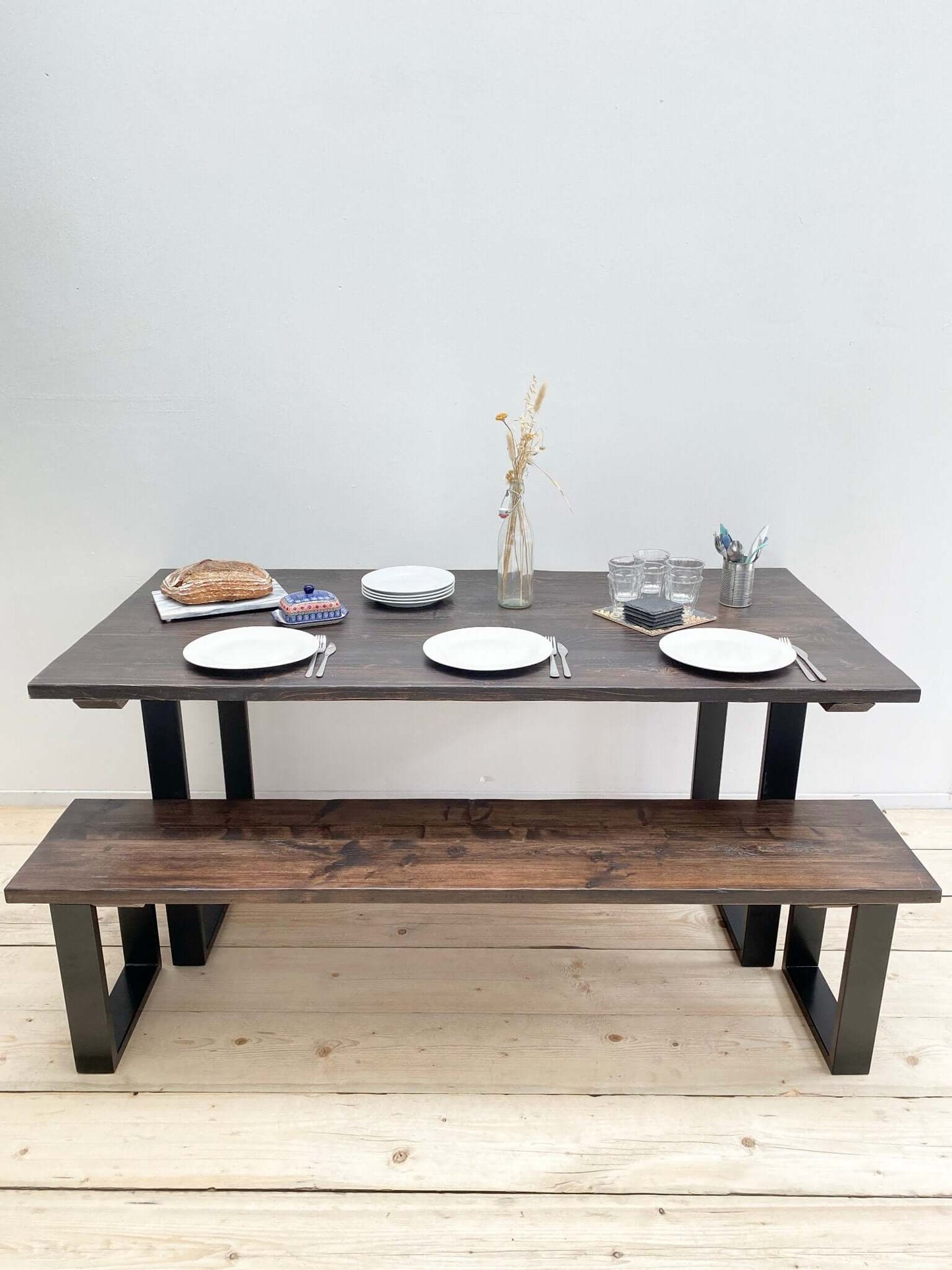 Reclaimed large dining table with industrial legs.