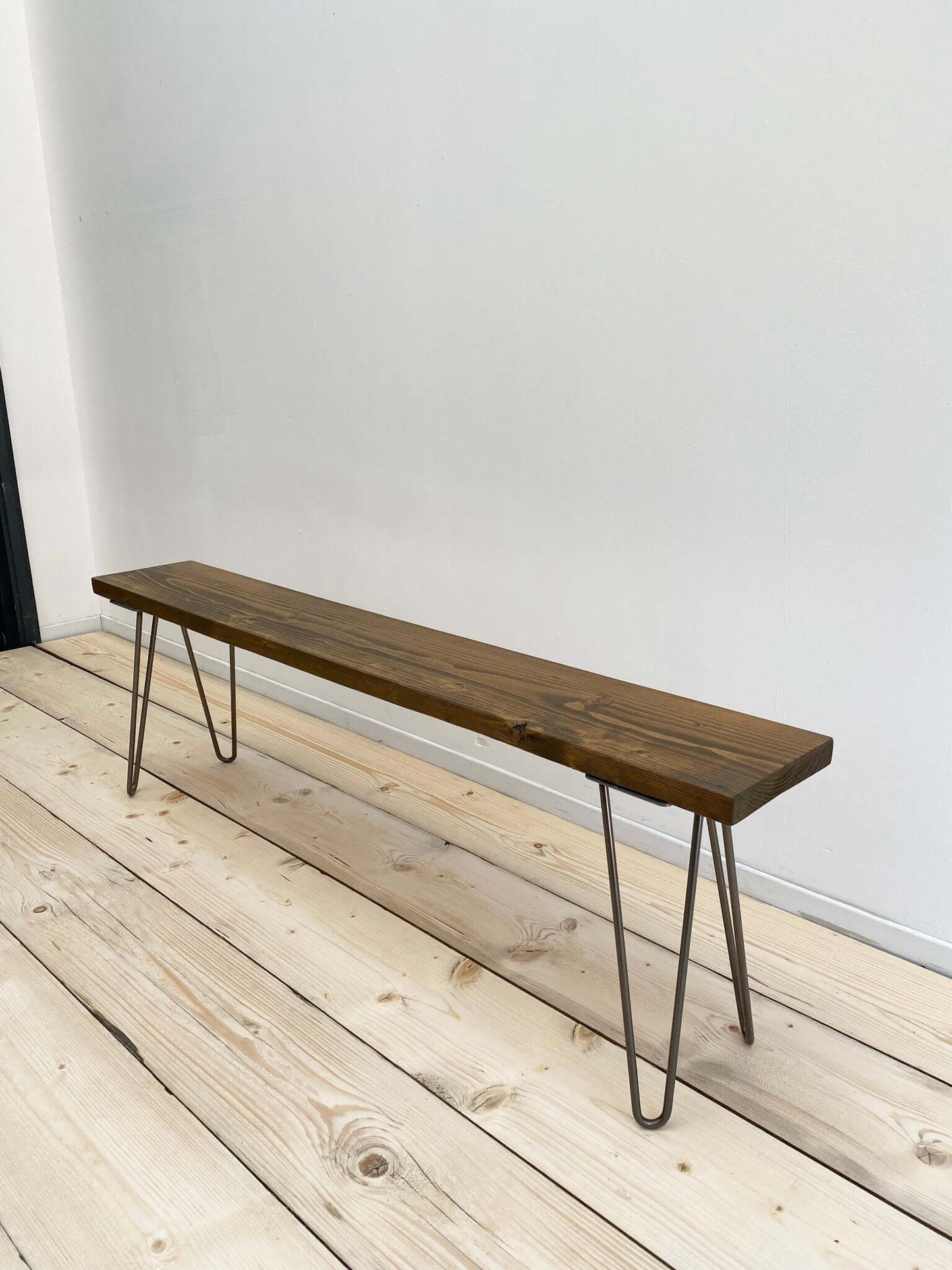 Reclaimed wood outdoor bench with hairpin legs.