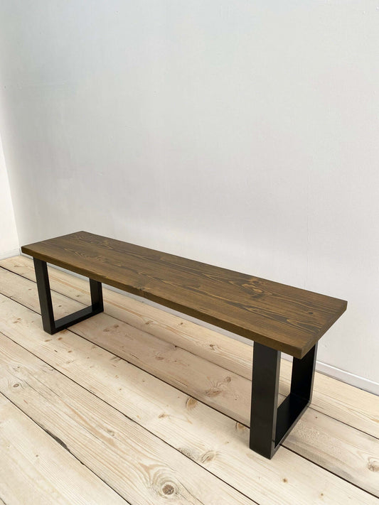 Reclaimed wood outdoor bench with industrial legs.