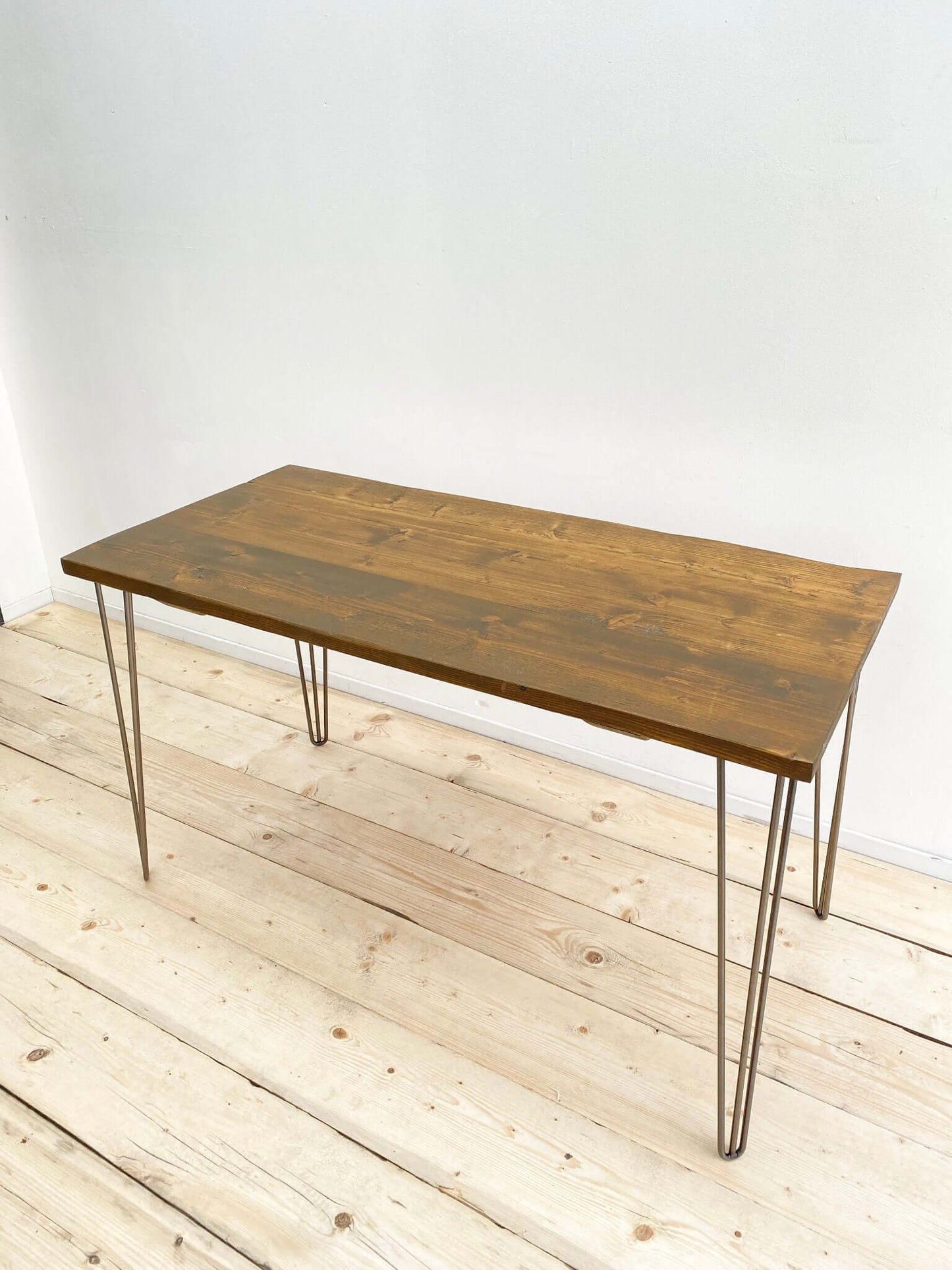 Reclaimed wood outdoor table with hairpin legs.