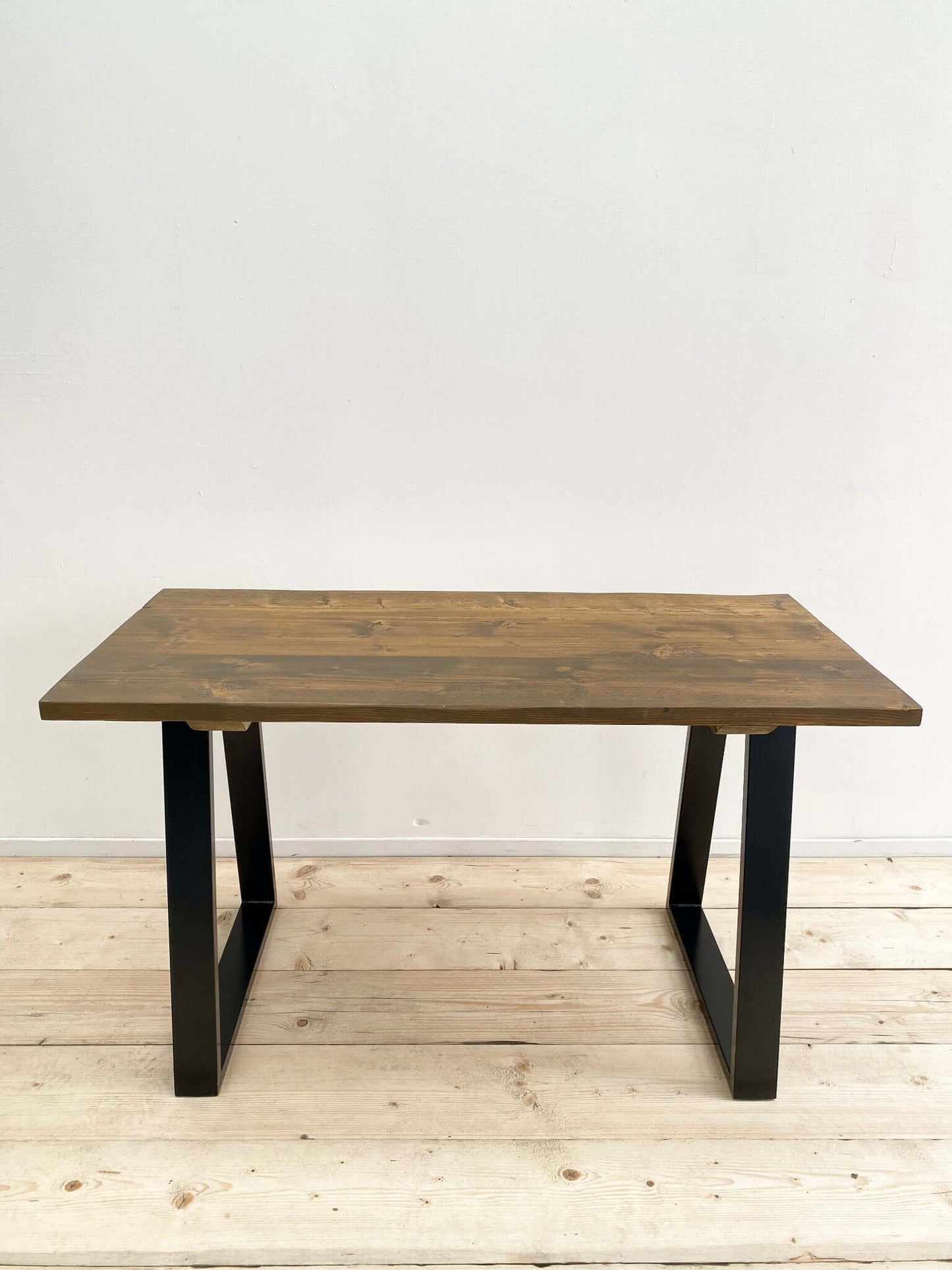 Reclaimed wood outdoor table with industrial legs.