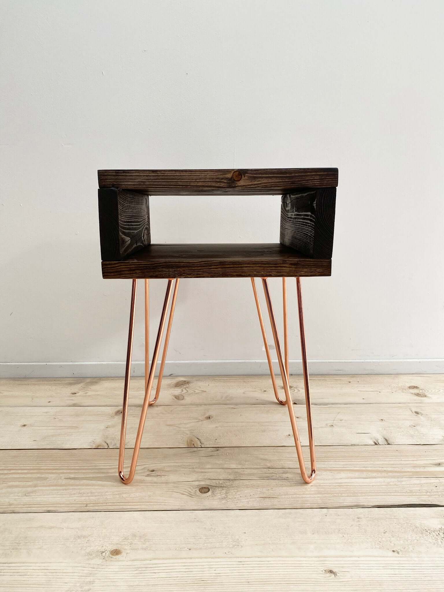 Reclaimed wood side table with hairpin legs.