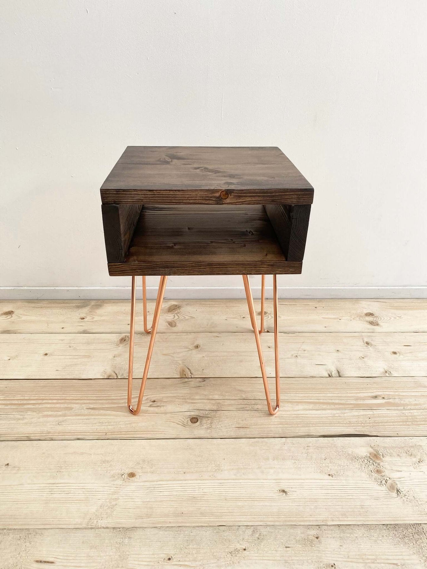 Reclaimed wood side table with hairpin legs.