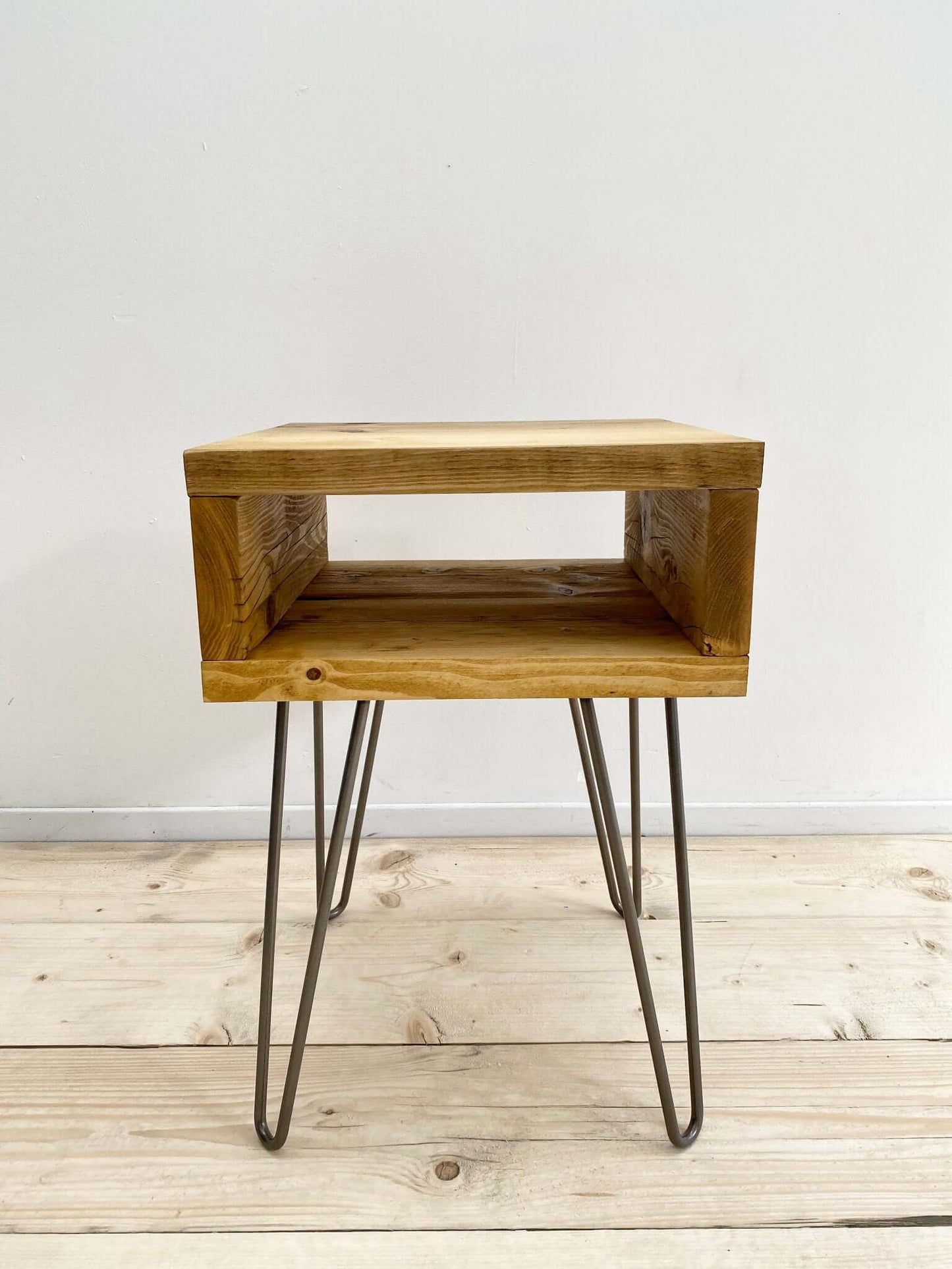 Reclaimed wood side table with hairpin legs.