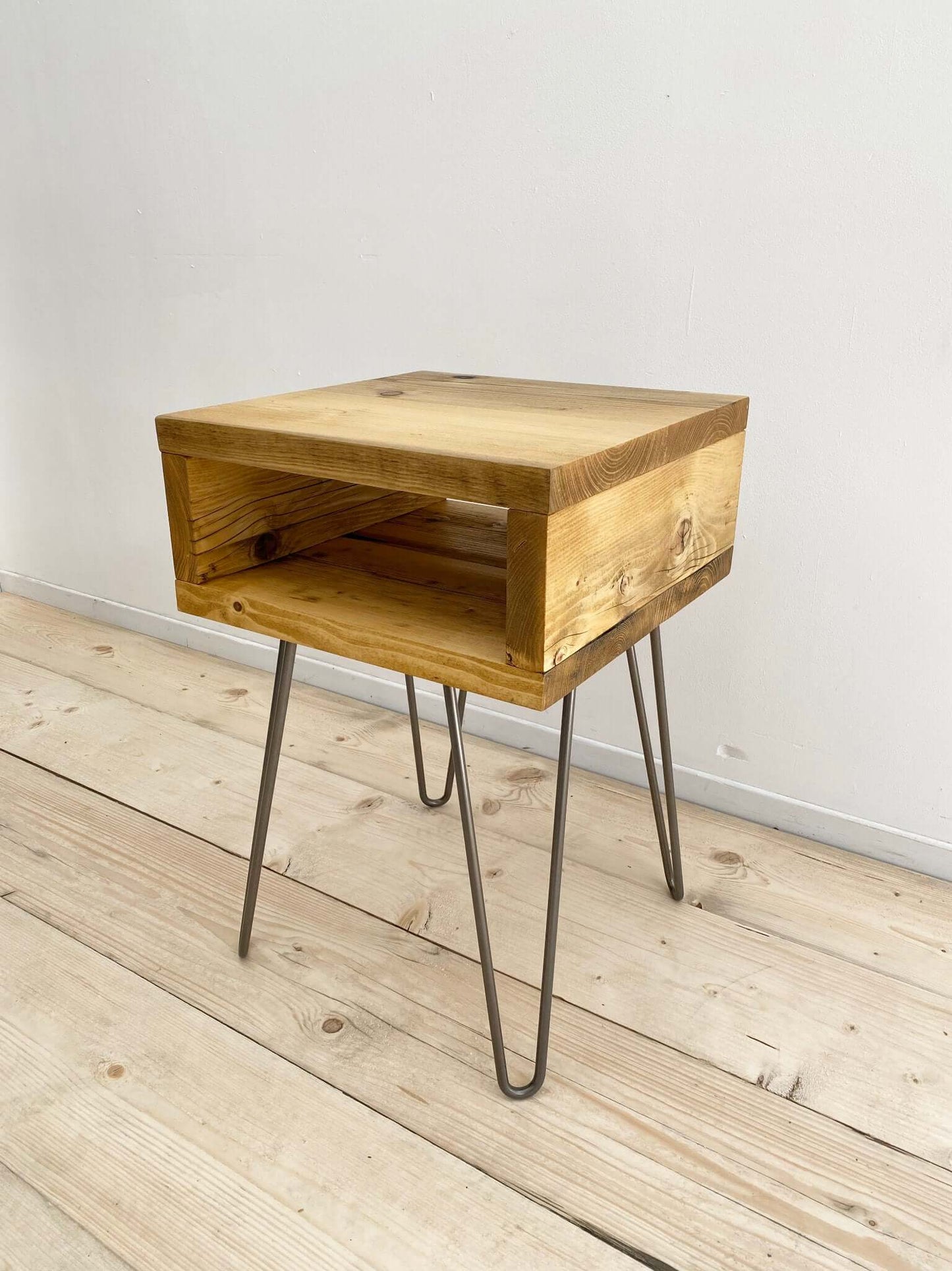 Reclaimed wood side table with hairpin legs.