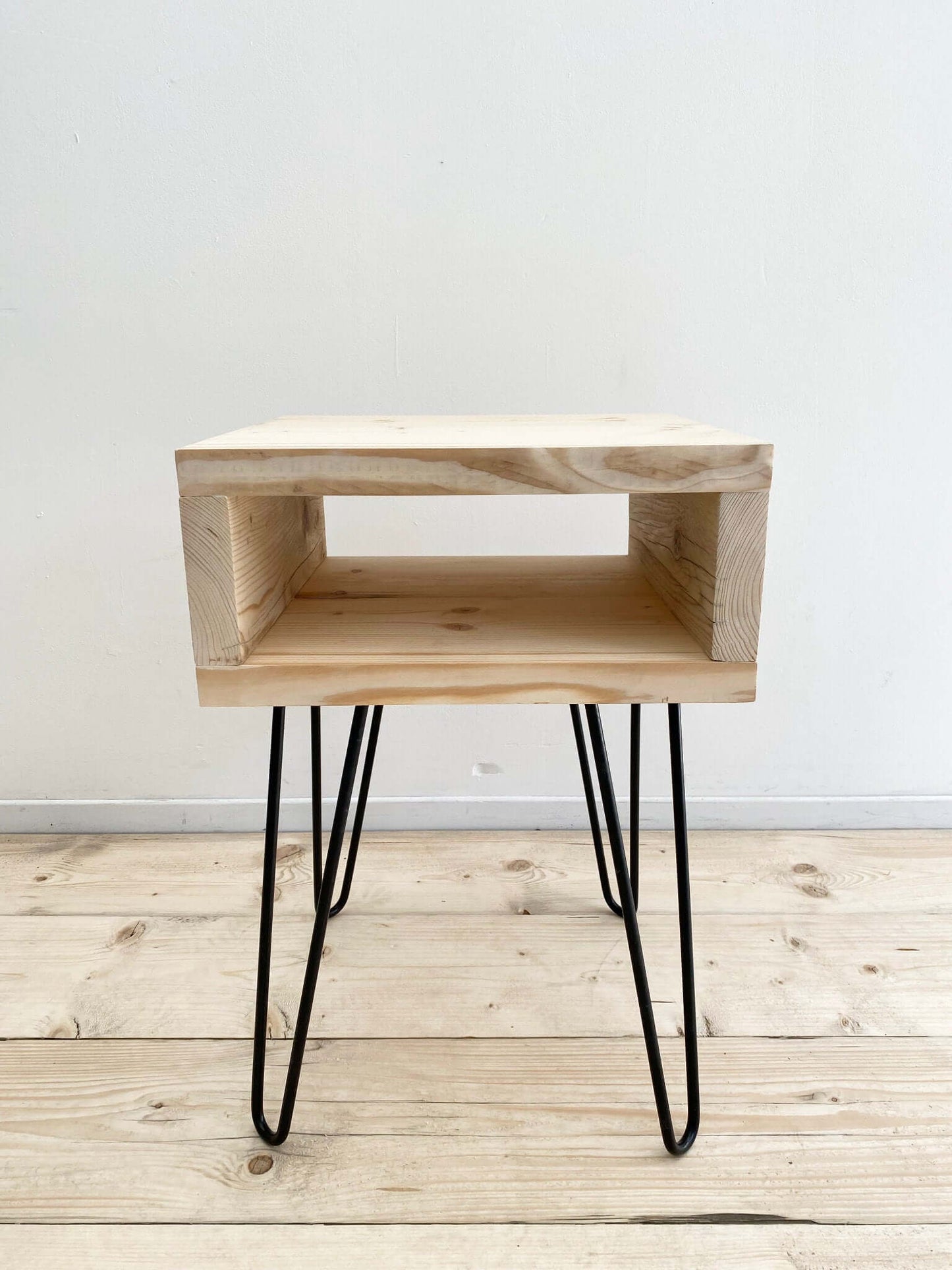 Reclaimed wood side table with hairpin legs.