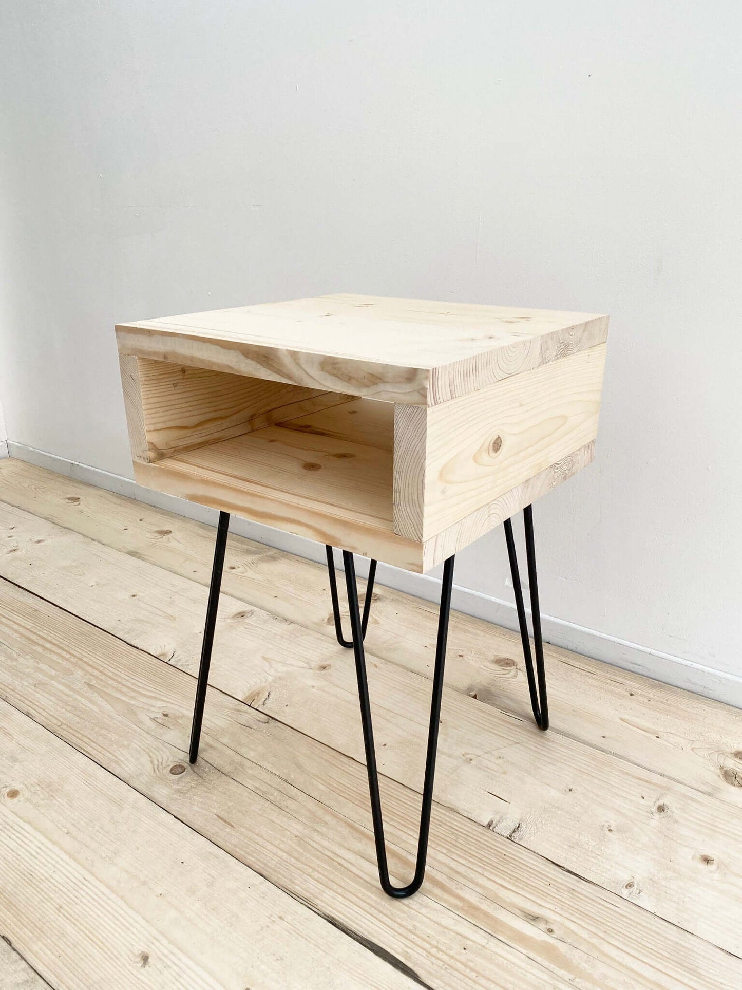 Reclaimed wood side table with hairpin legs.