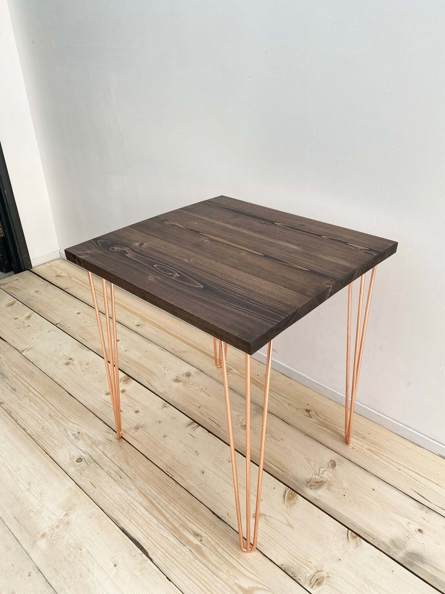 Reclaimed wood small dining table with hairpin legs.